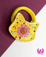 کش مو دخترانه گربه زرد با گل بابونه رزینی