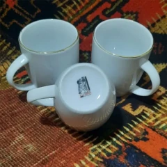 ماگ سفید لب طلا مارک تقدیس