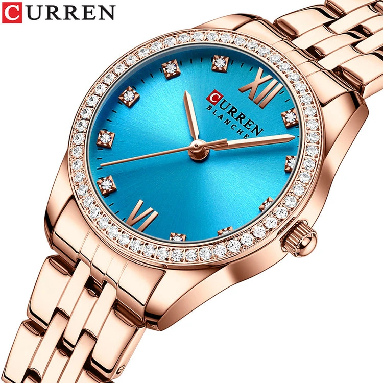 ساعت زنانه عقربه ای نگین دار کارن 9086 (کورن CURREN) رزگلد-آبی