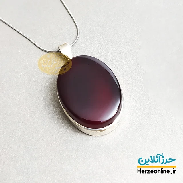 مدال گردن آویز نقره 925 عقیق سرخ دارای 4حرز شریف دستنویس روی پوست آهو