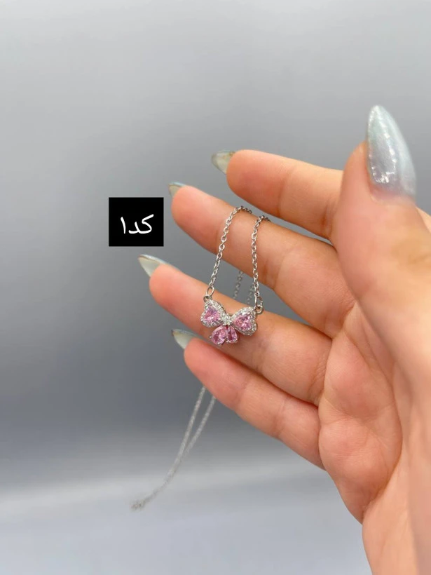 گردنبند صورتی جواهری پاپیونی