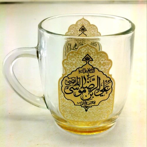 ۱۰۲۸۰۴-لیوان شیشه ای دسته دار ماگ شفاف طلایی یا علی بن موسی الرضا ع و یا فاطمه المعصومه س